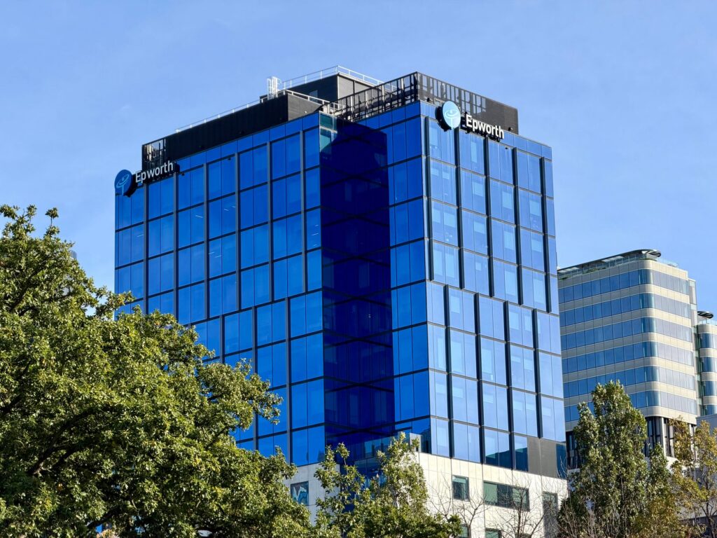 Modern glass facade of Epworth building in Box Hill, Victoria, Australia.